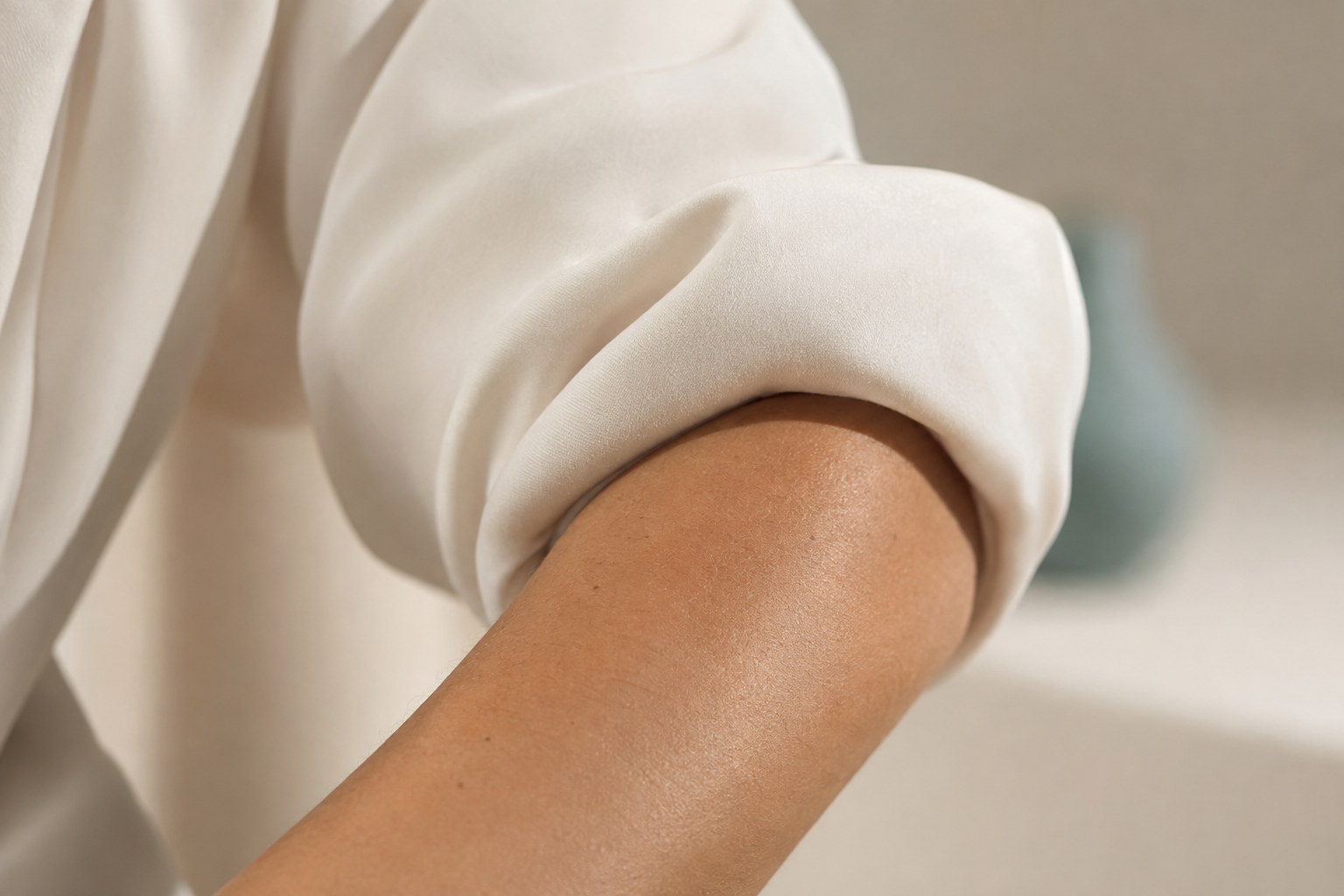 Natural skin in gentle contact with soft fabric